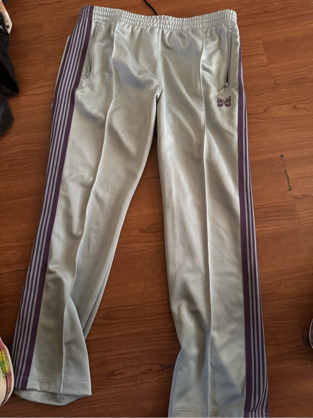 Needles men’s Track Pants in Light Sage with Purple Stripes